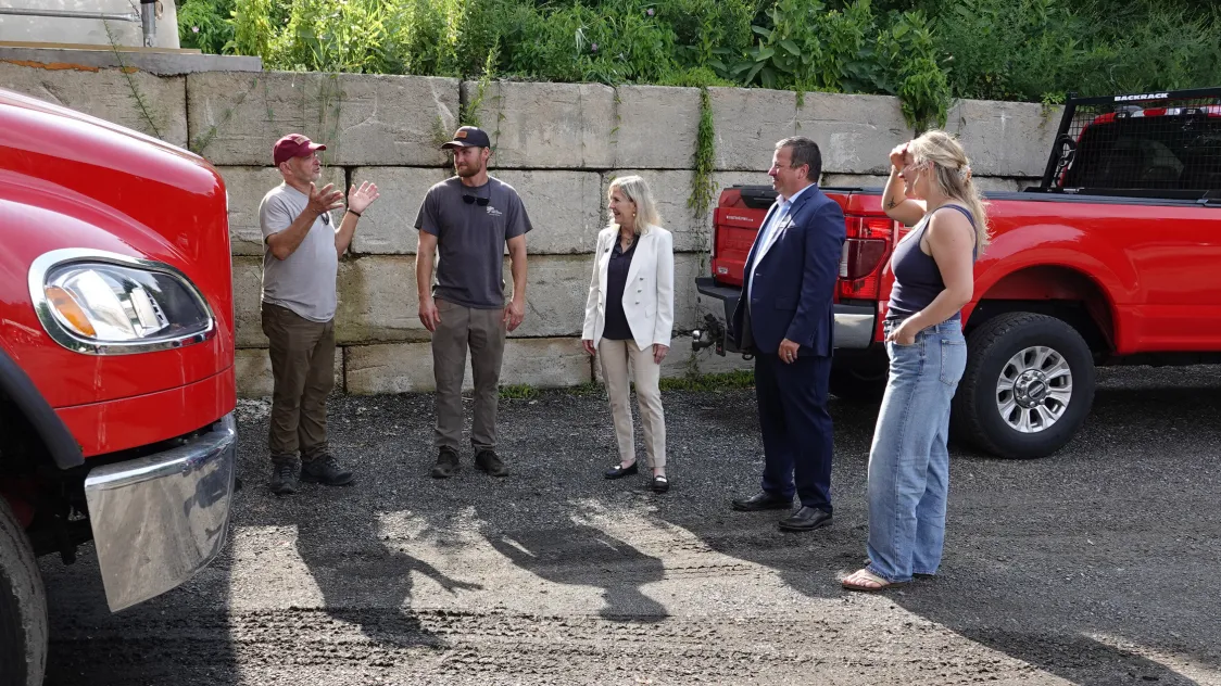 The Essex Bank lending team speaks with business customer Wilcox Tree Experts in Old Lyme, CT