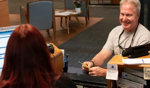 Essex Bank customer at the teller line