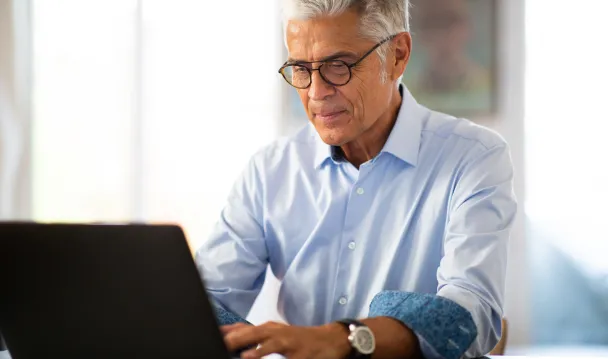 Man works on his laptop