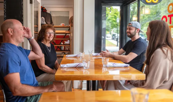 Essex Bank officer in conversation with OTTO Pizza team