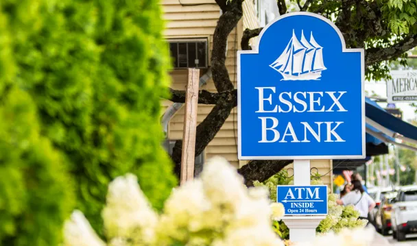 Essex Bank sign amongst flowers