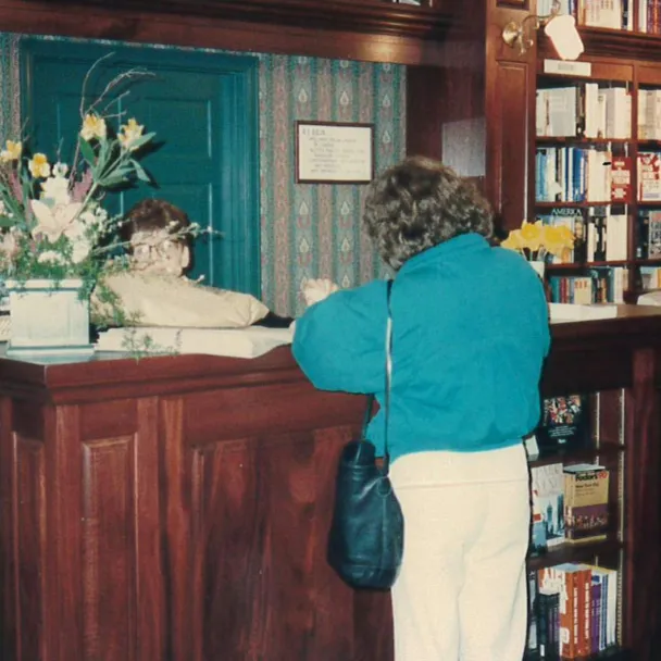 An RJ Julia customer purchases book at the Madison, CT store opening in 1990