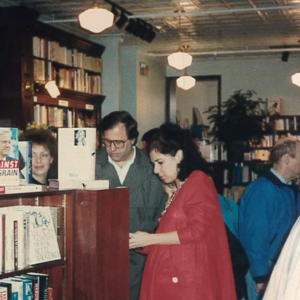 Essex Bank customer and RJ Julia founder Roxanne Coady talks with a store customer in 1990