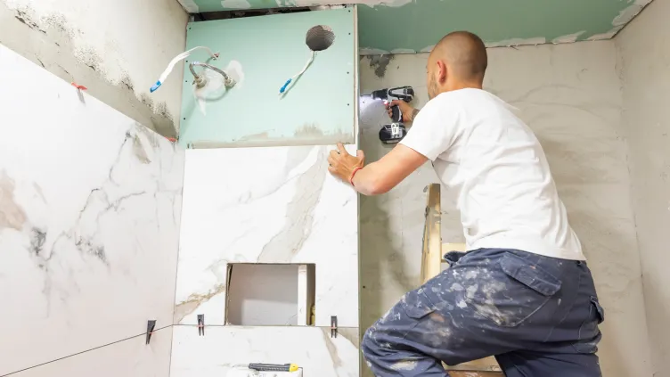 Man remodeling a bathroom